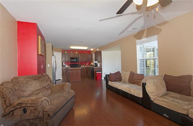 1044 Countess Lane Spring Hill, TN 37174 - Photo 7 of 20 Huge living room makes for a great place to relax for a quiet movie and have friends over to enjoy the game.