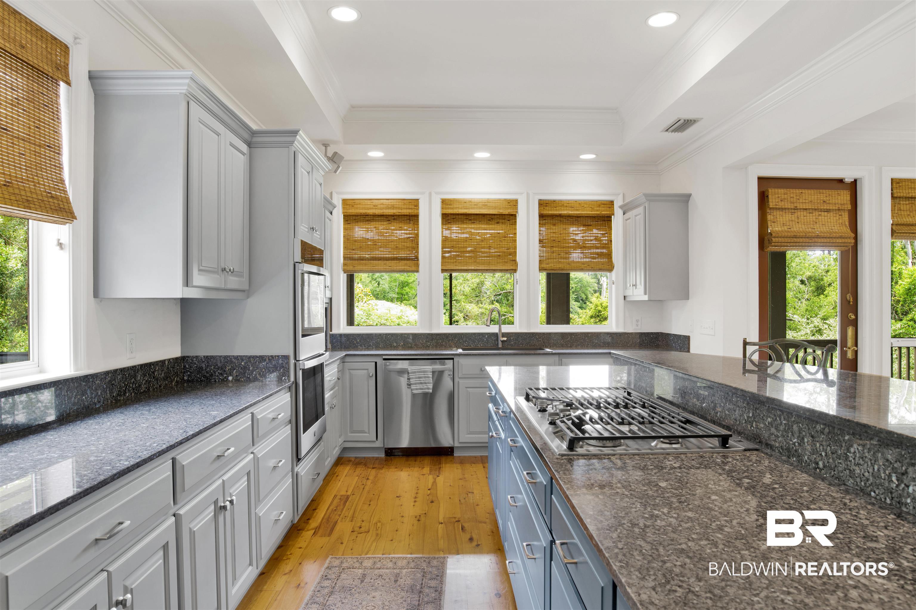 16864 Ferry Rd Circle Fairhope, AL 36532 - Photo 24 of 68 Kitchen featuring appliances with stainless steel finishes, a sink, gray cabinets, light wood-style floors, and recessed lighting