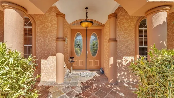 a front view of a house with large windows
