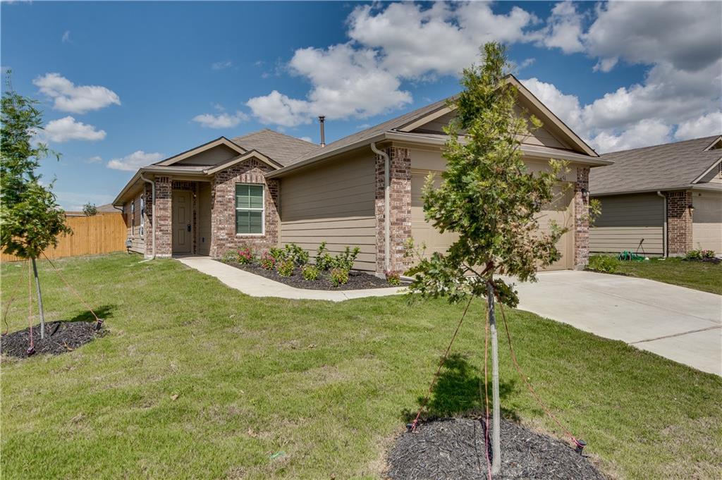 185 Voss Kyle, TX 78640 - Photo 22 of 26 a front view of a house with garden