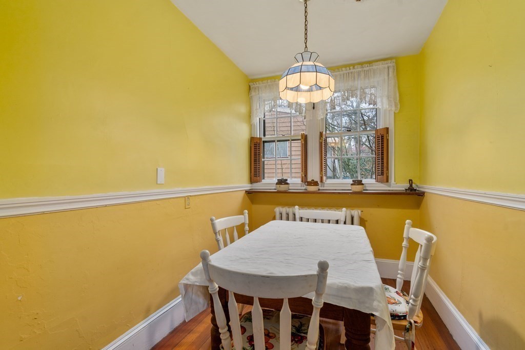 13 Ravine Street Arlington, MA 02476 - Photo 14 of 42 a view of a dining room with furniture and a chandelier