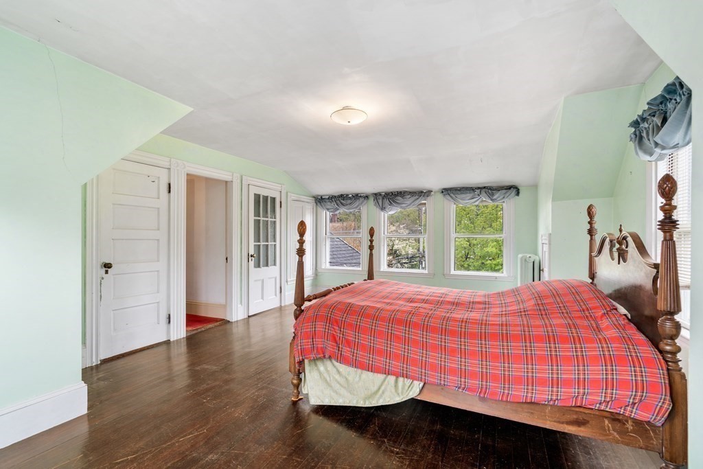 13 Ravine Street Arlington, MA 02476 - Photo 16 of 42 a bedroom with a bed and a window