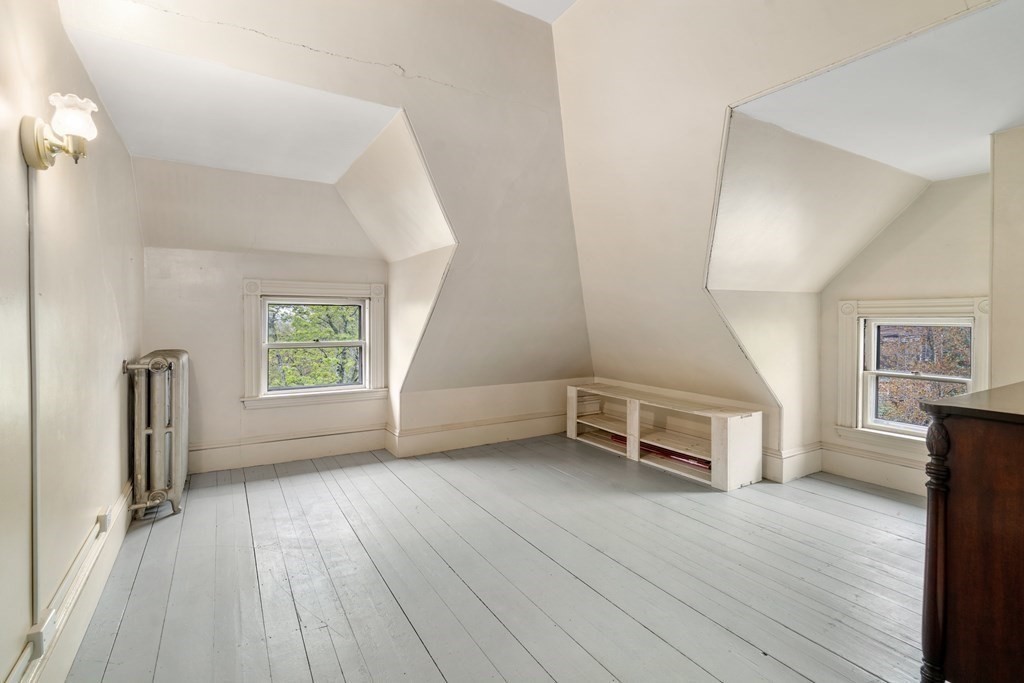 13 Ravine Street Arlington, MA 02476 - Photo 19 of 42 wooden floor in an empty room with a window