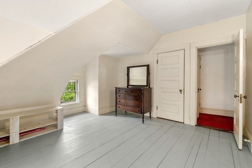 13 Ravine Street Arlington, MA 02476 - Photo 20 of 42 an empty room with windows and wardrobe