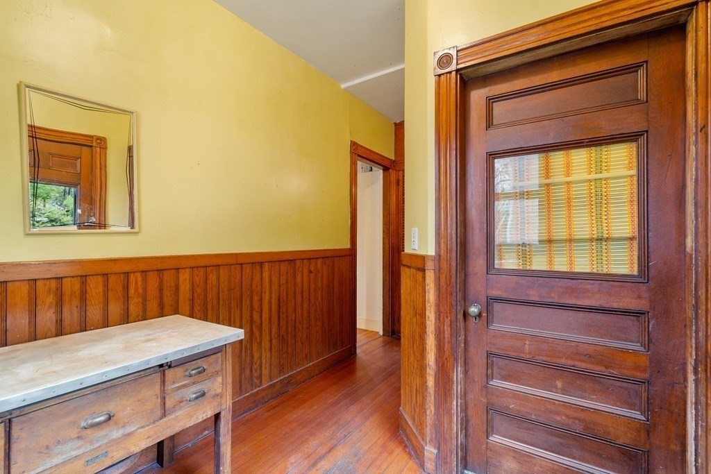 13 Ravine Street Arlington, MA 02476 - Photo 32 of 42 a view of a hallway with wooden floor and a cabinet