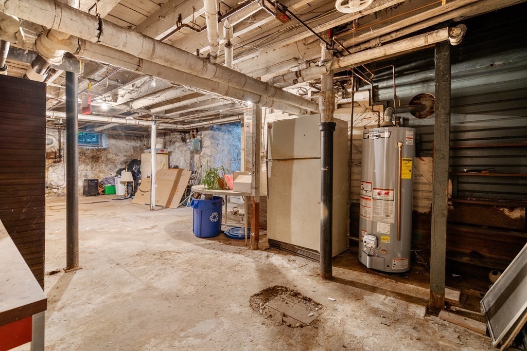 13 Ravine Street Arlington, MA 02476 - Photo 35 of 42 a view of water heater room with a refrigerator