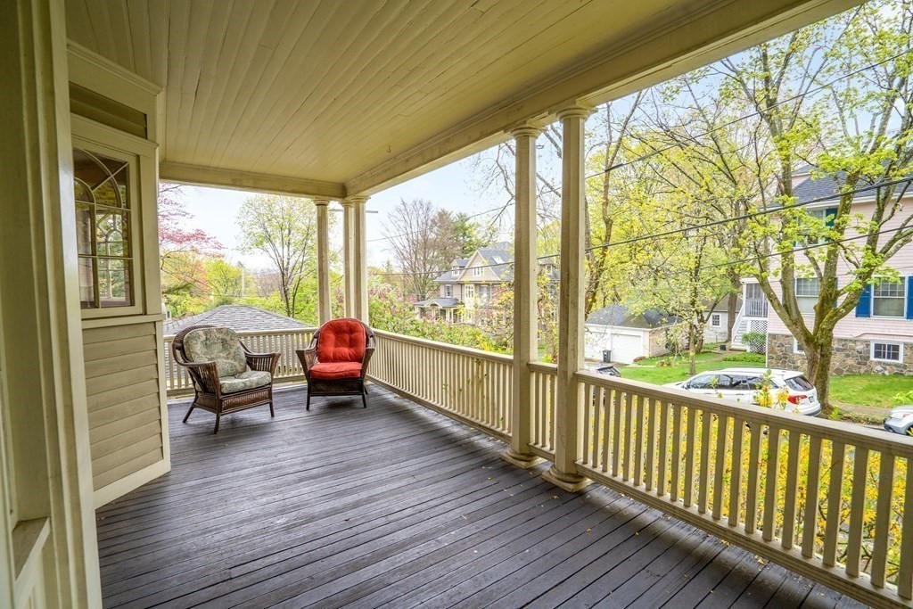 13 Ravine Street Arlington, MA 02476 - Photo 36 of 42 a living room with large windows and wooden floor