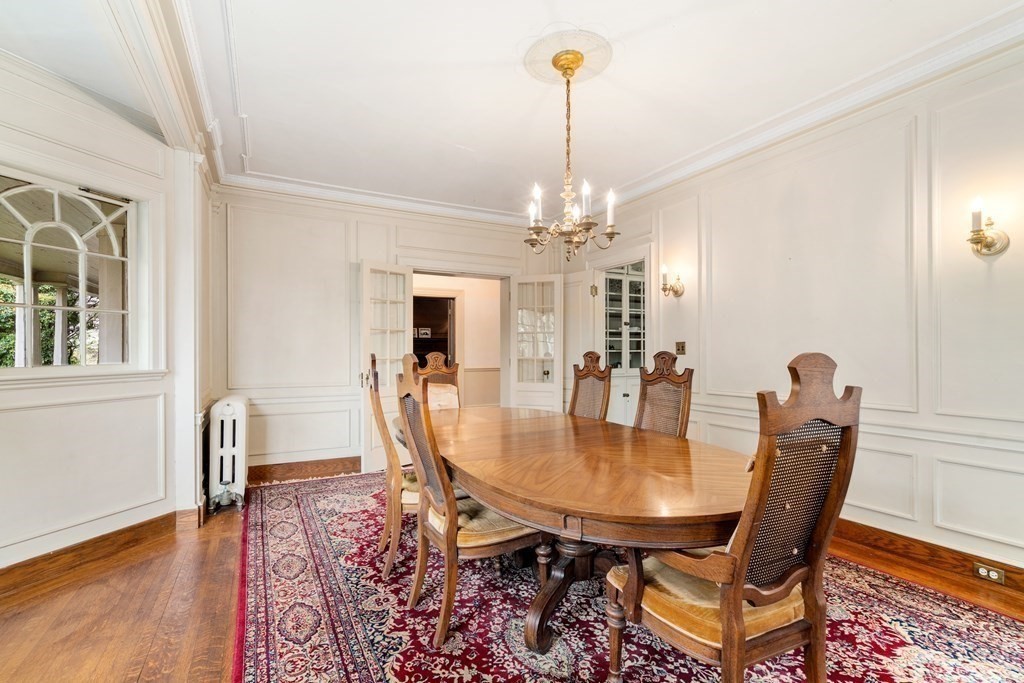 13 Ravine Street Arlington, MA 02476 - Photo 6 of 42 a dining room with furniture a chandelier and wooden floor