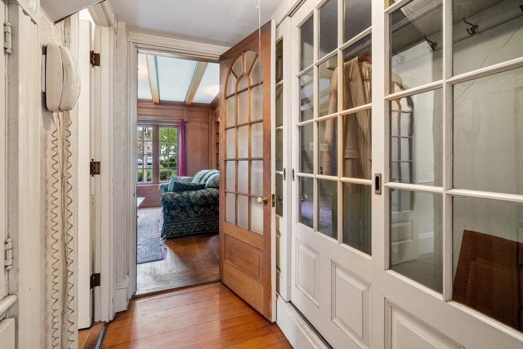 13 Ravine Street Arlington, MA 02476 - Photo 8 of 42 a view of walk in closet with wooden floor and windows