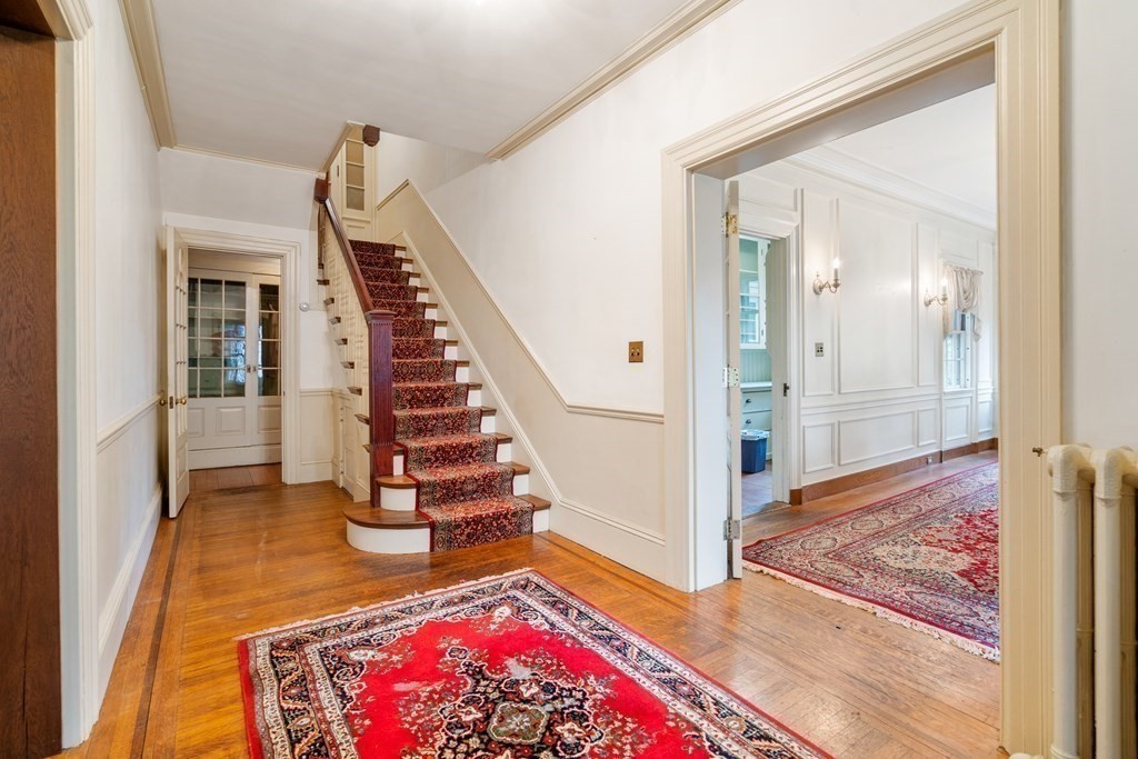 13 Ravine Street Arlington, MA 02476 - Photo 9 of 42 a view of entryway and hall with wooden floor