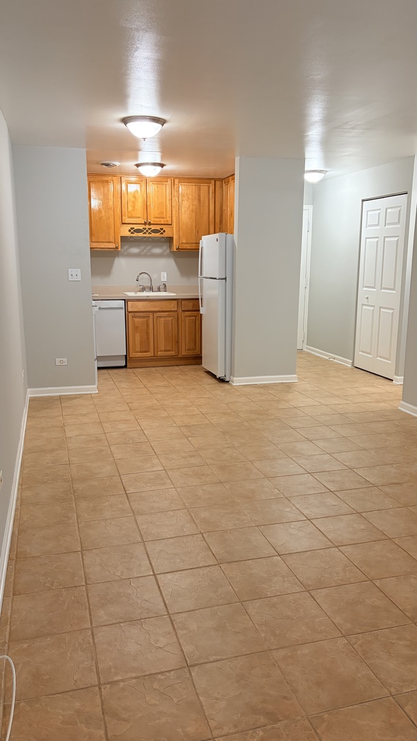 310 Lathrop Avenue, Unit 307 Forest Park, IL 60130 - Photo 20 of 41 a view of a kitchen with a sink and a refrigerator