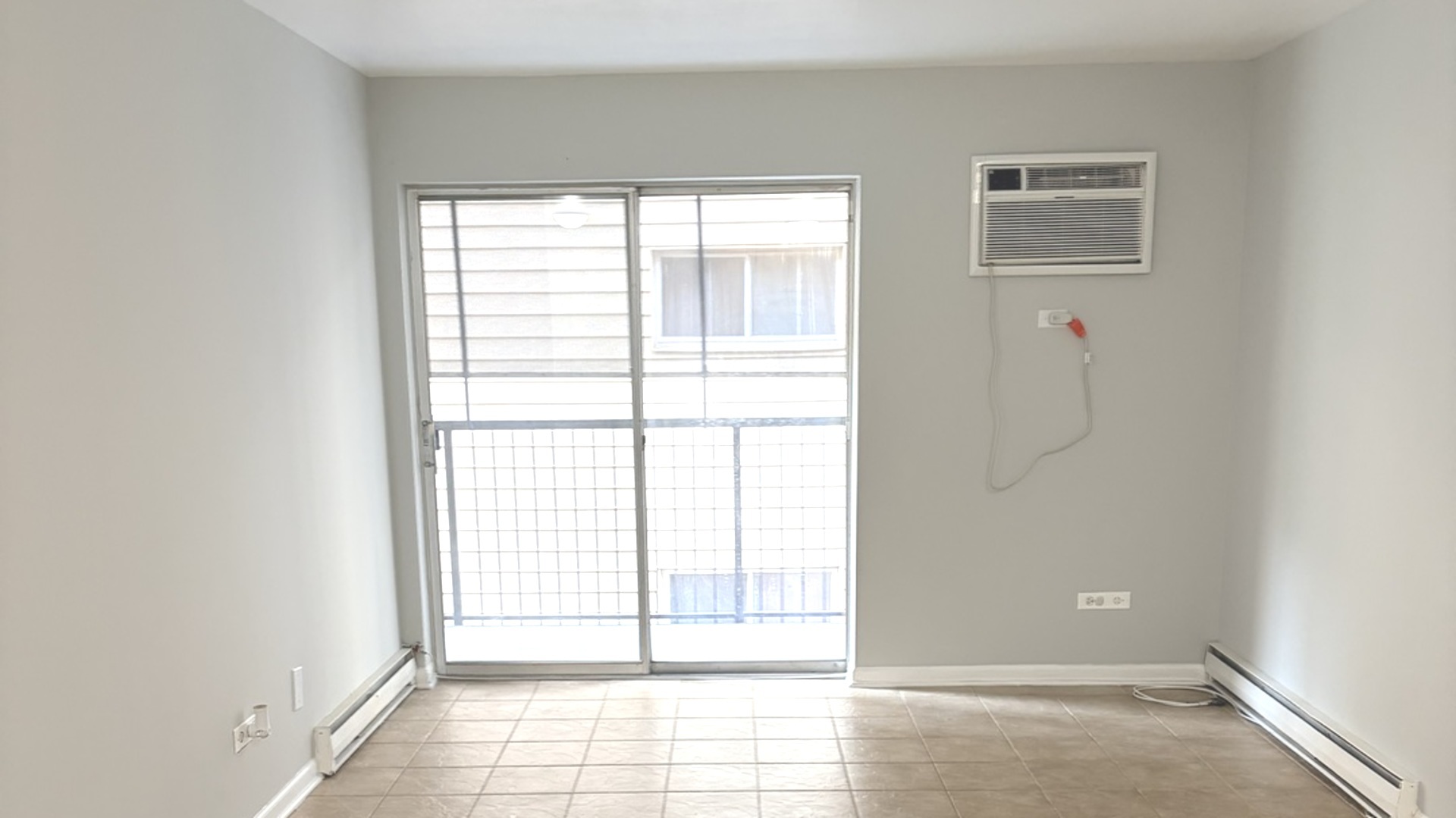 310 Lathrop Avenue, Unit 307 Forest Park, IL 60130 - Photo 30 of 41 a view of an empty room with wooden floor and a window