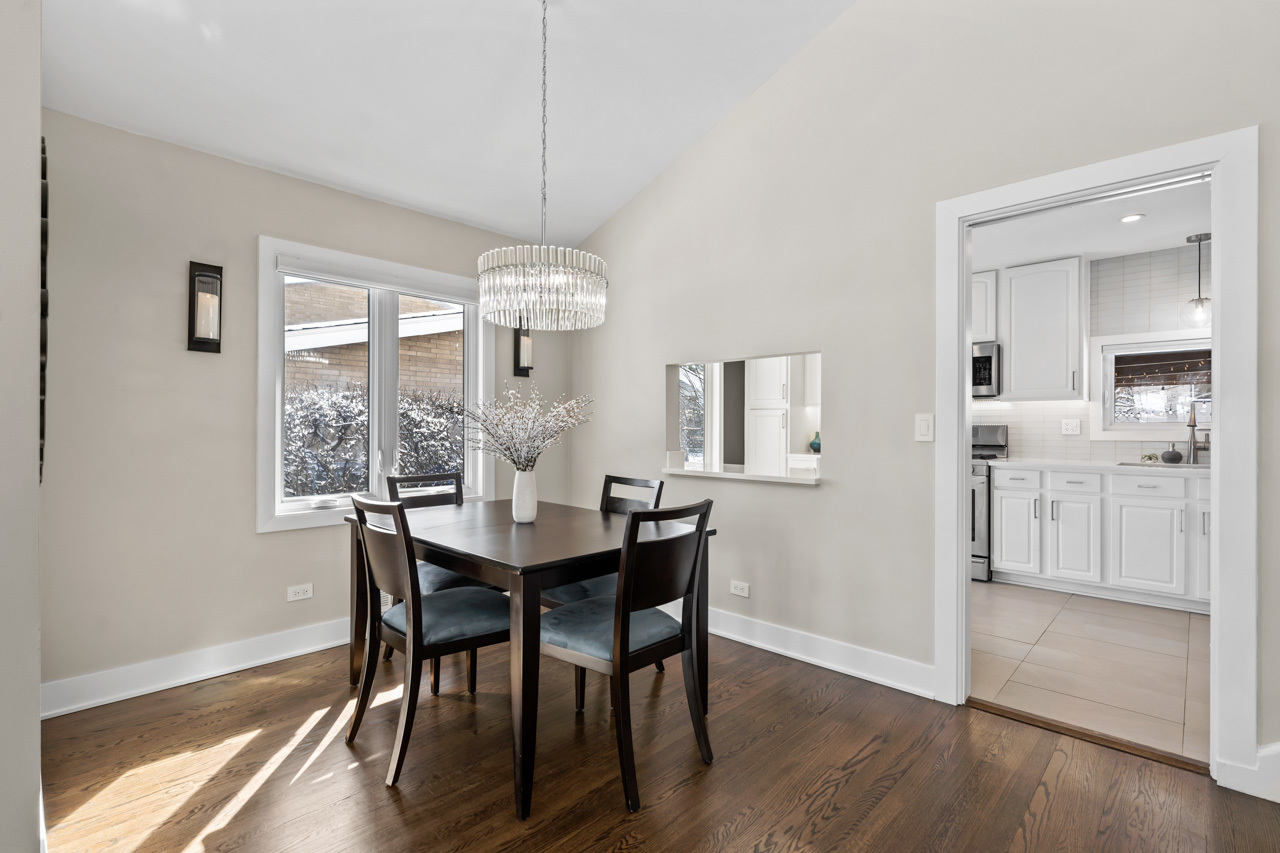 5 East Sunset Road Mount Prospect, IL 60056 - Photo 11 of 46 a view of a dining room with furniture window and wooden floor