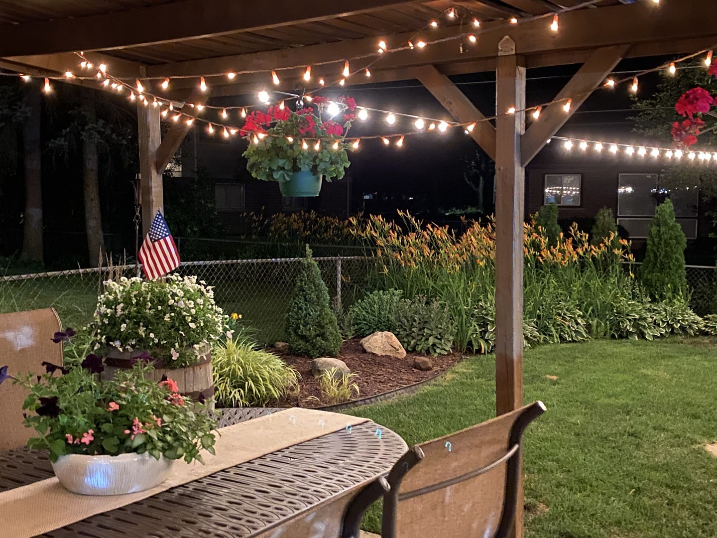 5 East Sunset Road Mount Prospect, IL 60056 - Photo 42 of 46 a view of a porch with dining table and chairs potted plants