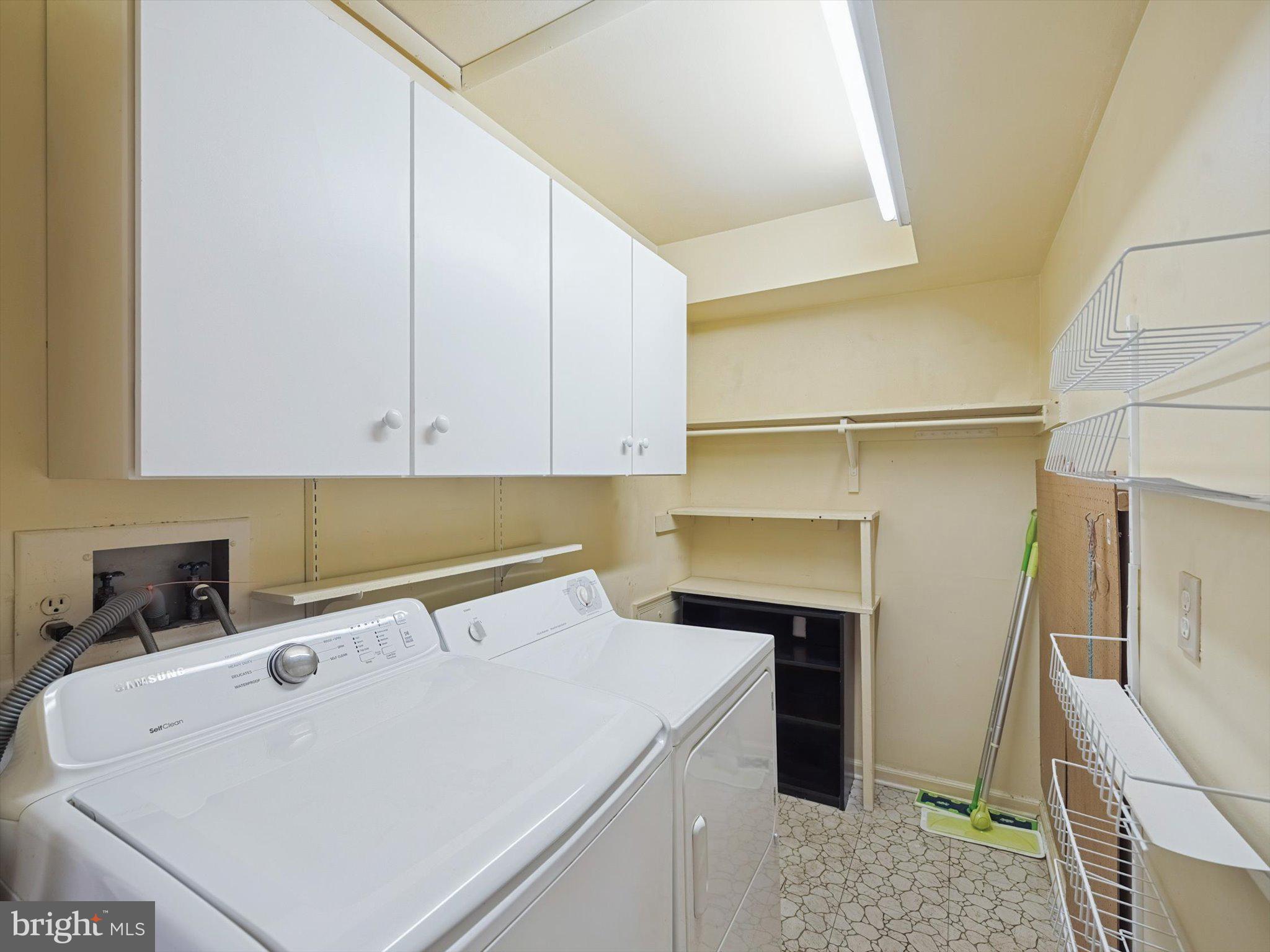3204 Delaire Landing Road, Unit 3204 Philadelphia, PA 19114 - Photo 28 of 39 Laundry Room with Cabinets & Shelving
