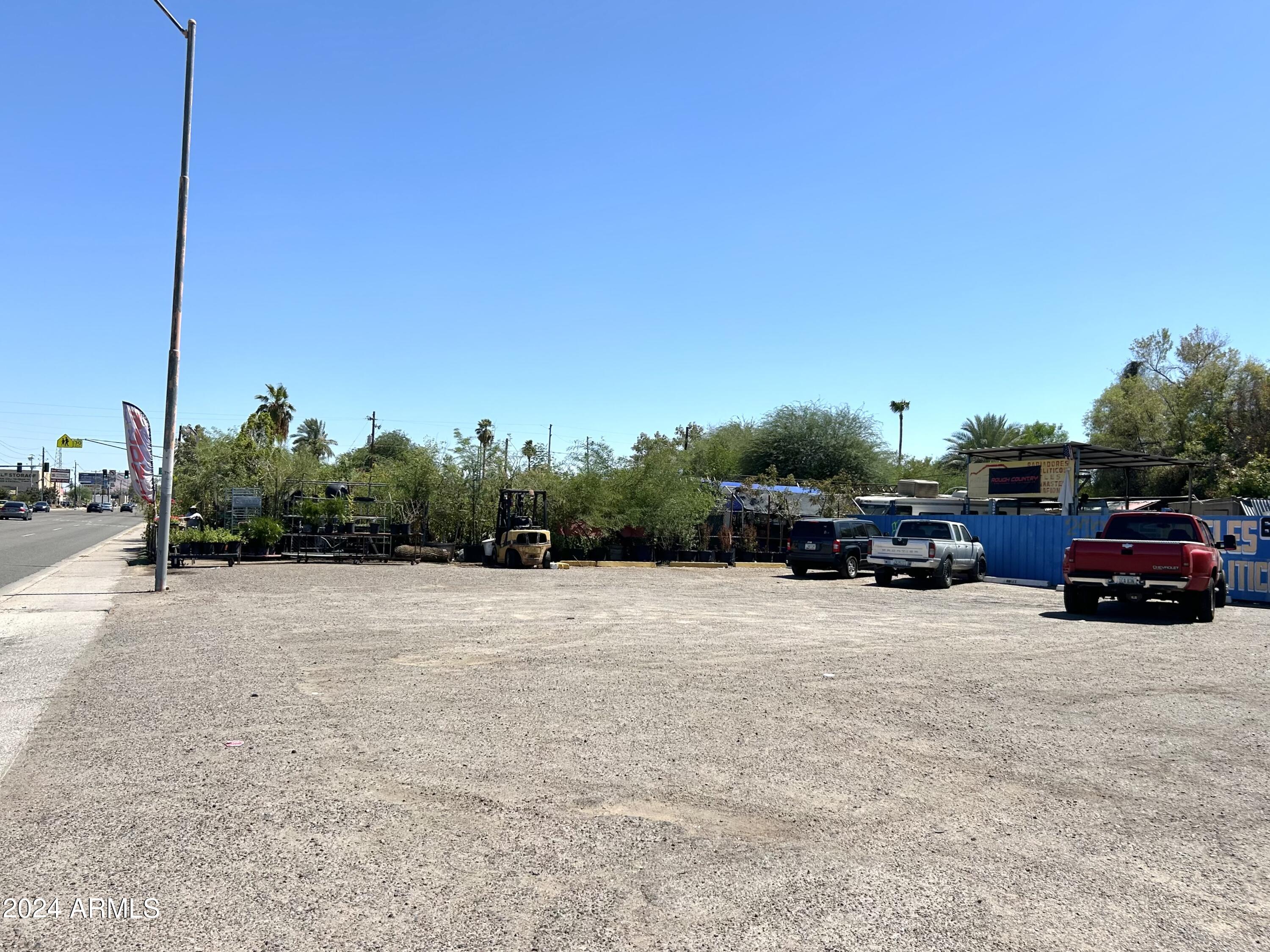 2729 East McDowell Road, Unit 15 Phoenix, AZ 85008 - Photo 3 of 9 a car parked on the side of the road