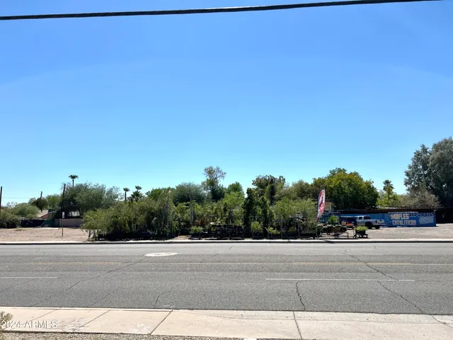 a view of a chair and table in the backyard
