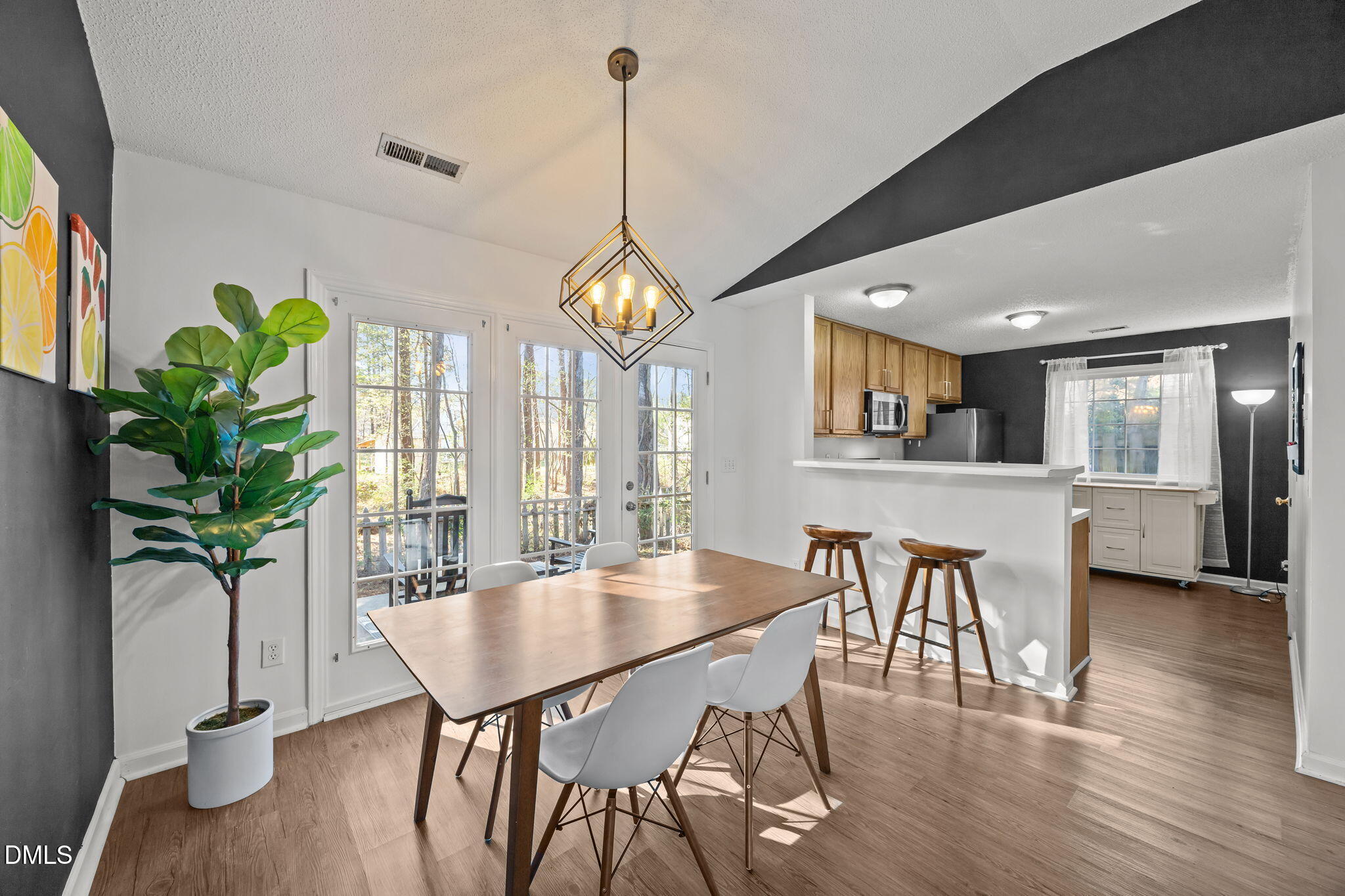 2208 Walnut Ridge Court Raleigh, NC 27610 - Photo 13 of 24 a view of a dining room with furniture window and wooden floor