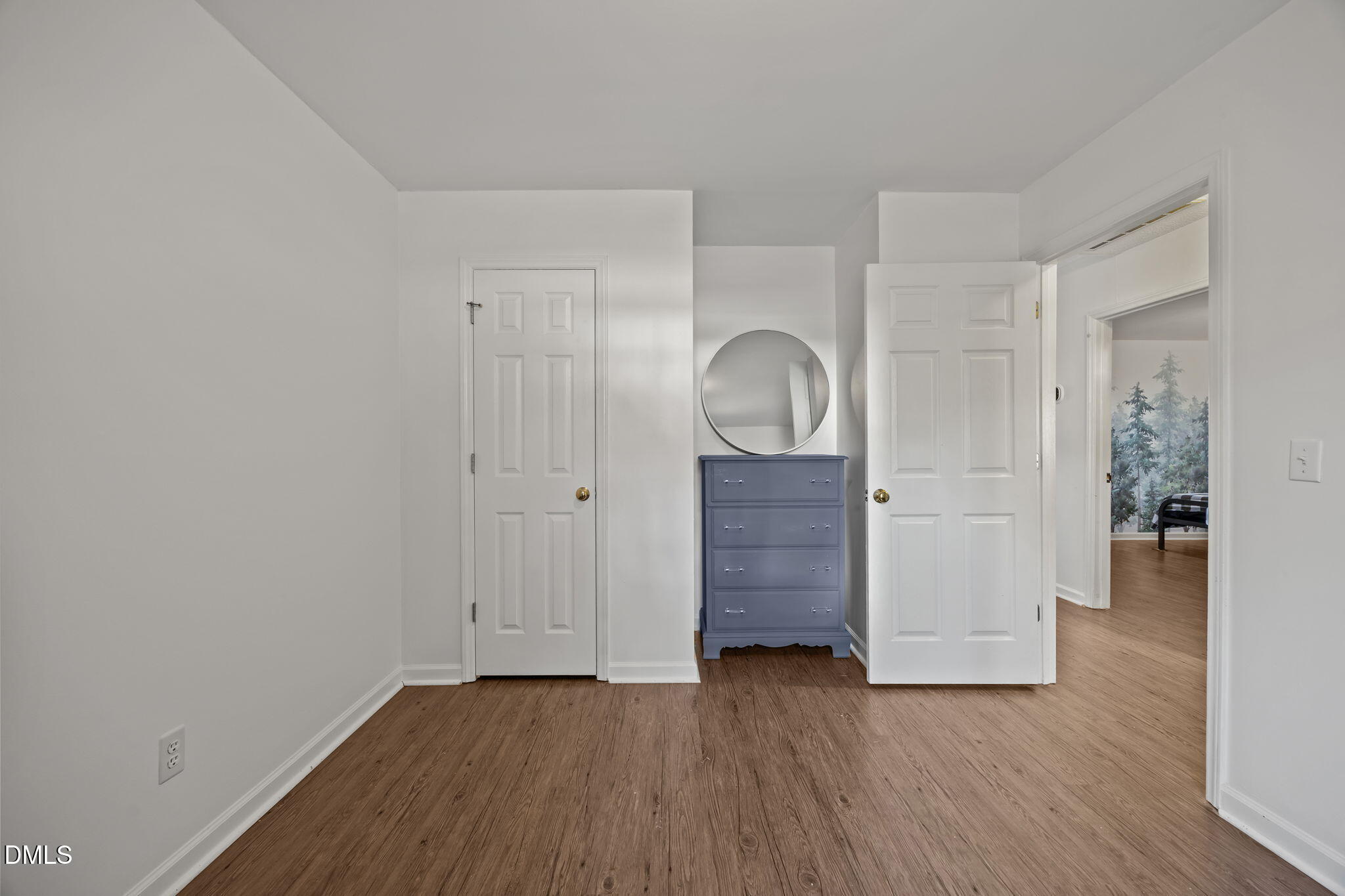 2208 Walnut Ridge Court Raleigh, NC 27610 - Photo 22 of 24 a view of an entryway with wooden floor