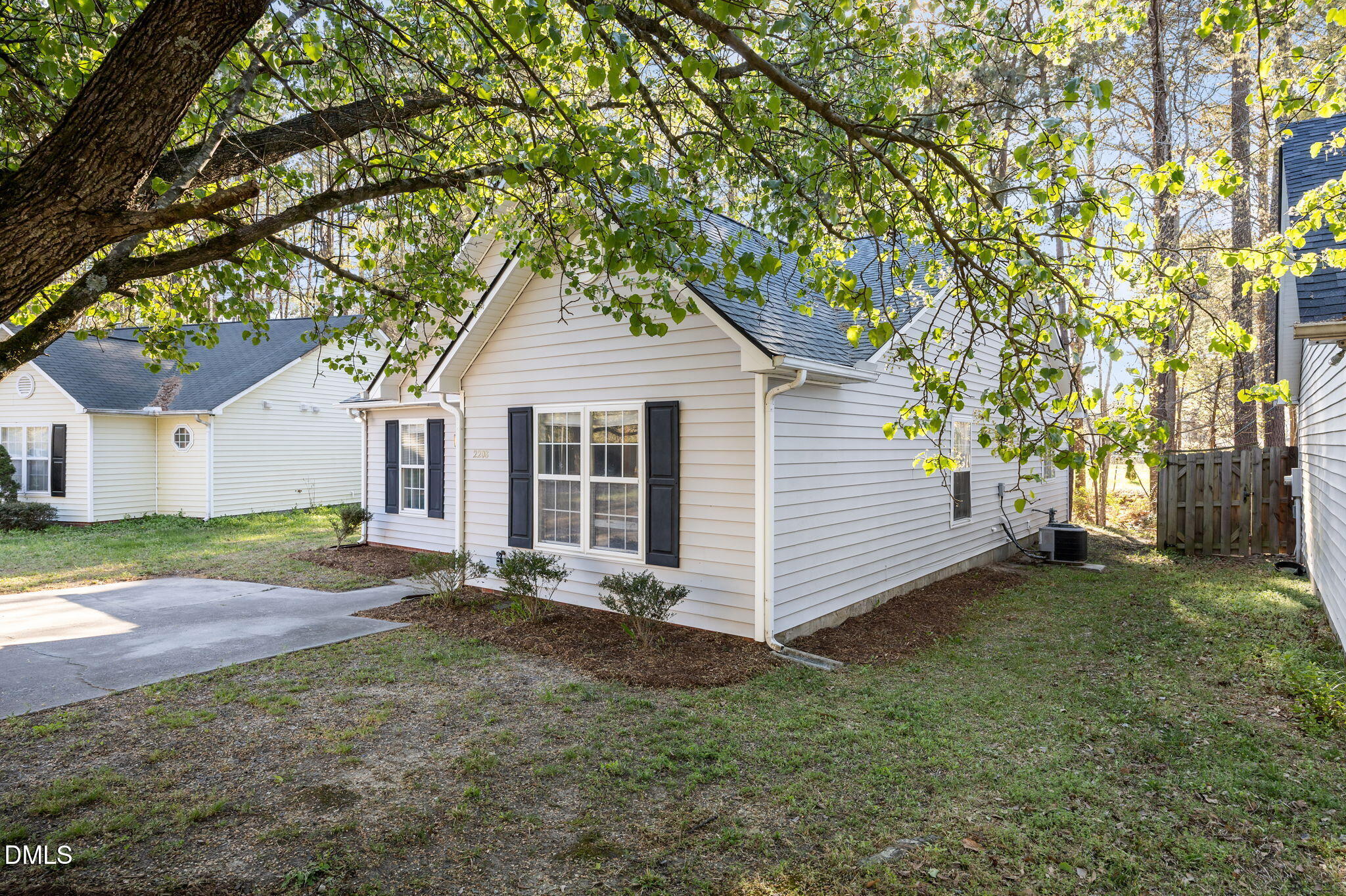 2208 Walnut Ridge Court Raleigh, NC 27610 - Photo 3 of 24 a front view of a house with a garden