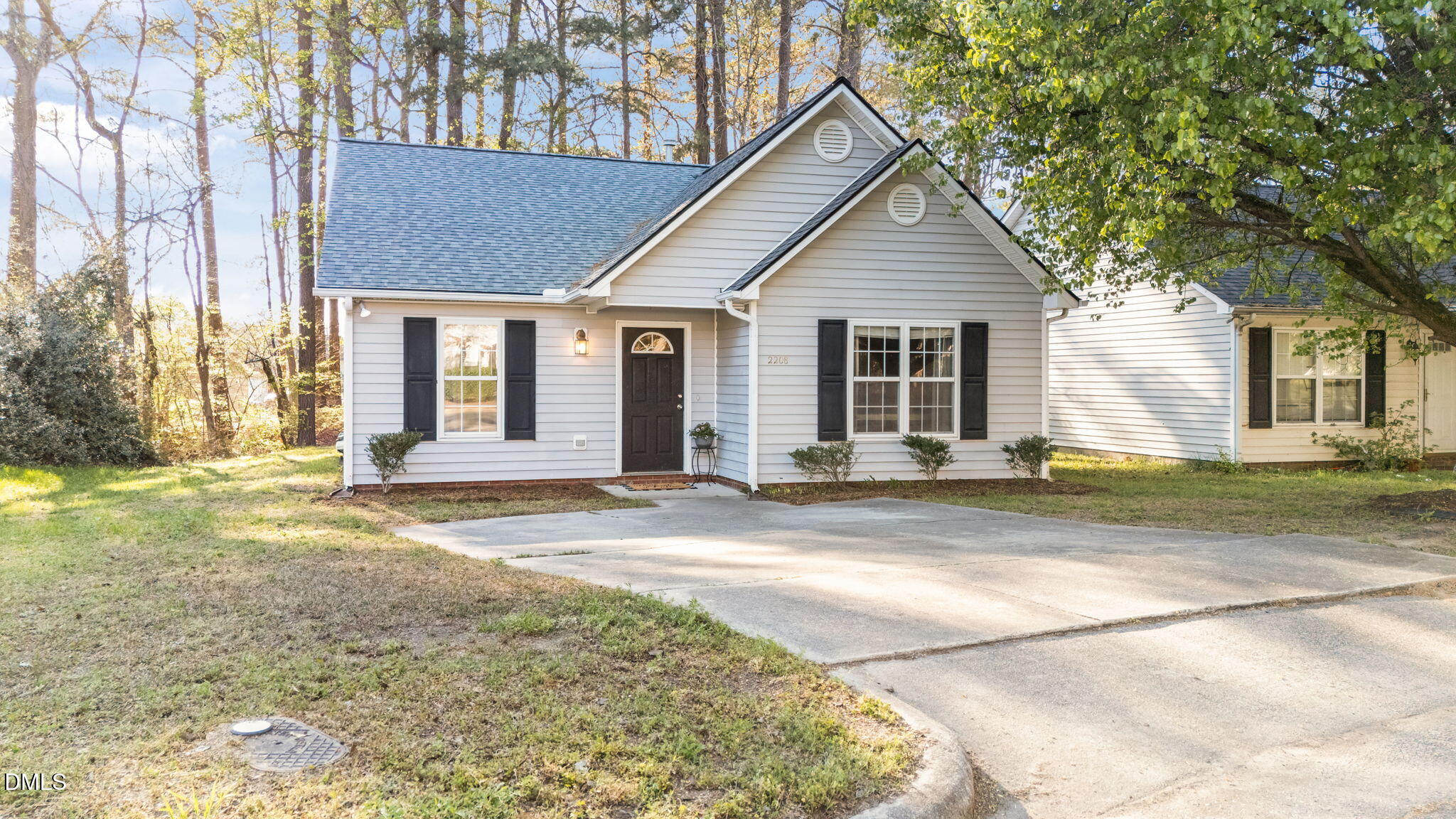 2208 Walnut Ridge Court Raleigh, NC 27610 - Photo 4 of 24 a view of a house with a yard and large tree