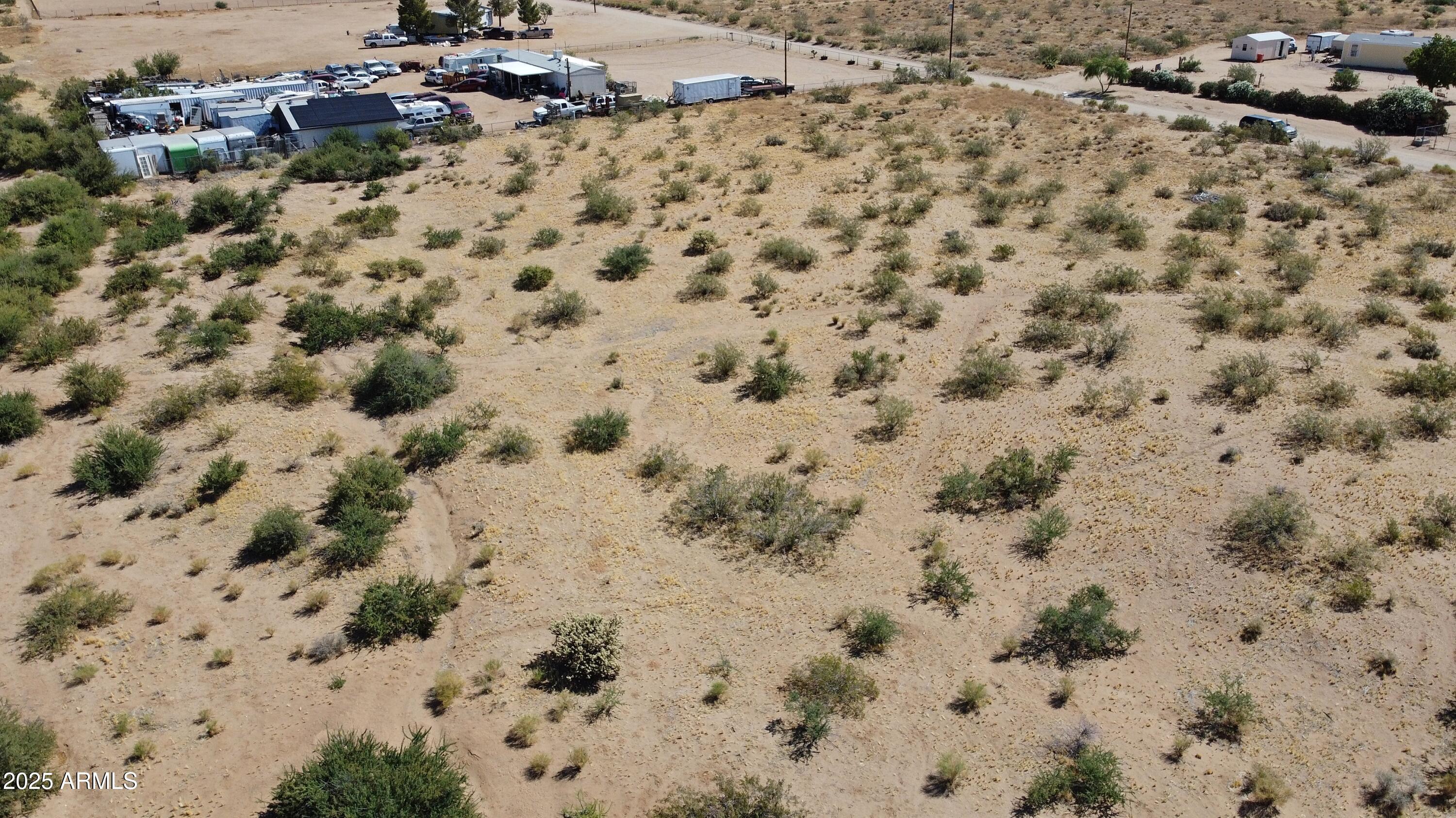 Lot 5 North N1/2 N Magma Road, Unit 5 Golden Valley, AZ 86413 - Photo 2 of 6 a view of a dry yard covered with snow
