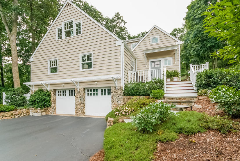 19 Steeple Top Road Rowayton, CT 06853 - Photo 1 of 1 a front view of a house with a garden