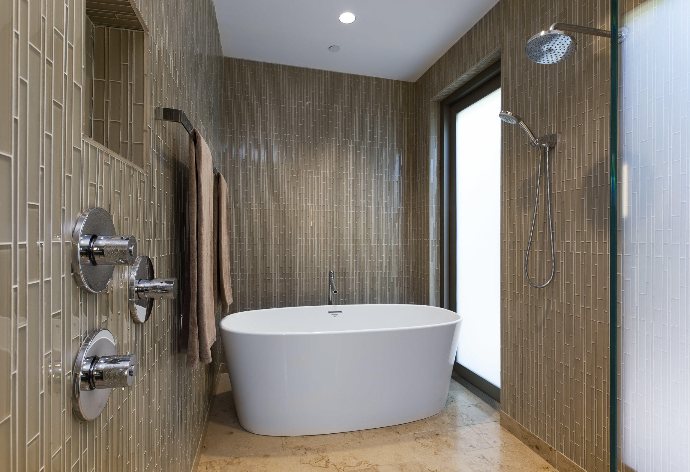 1147 Hill Road Santa Barbara, CA 93108 - Photo 12 of 23 a white bath tub sitting in a bathroom