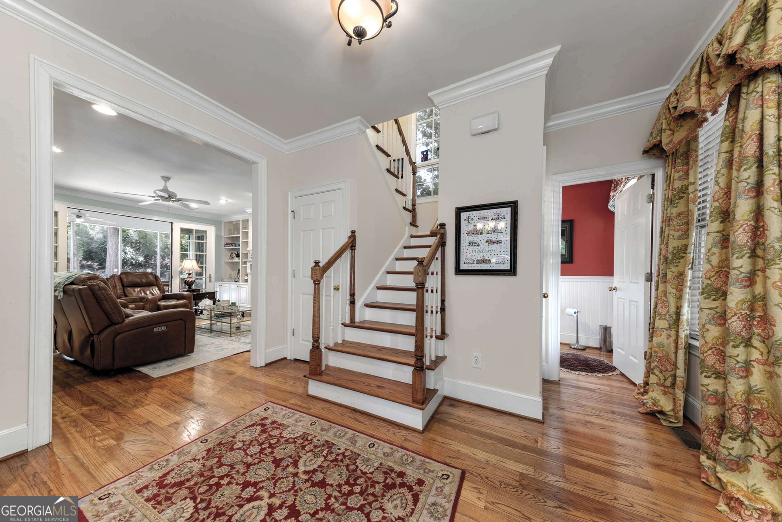 524 Hillside Road Madison, GA 30650 - Photo 11 of 54 a living room with furniture and a wooden floor