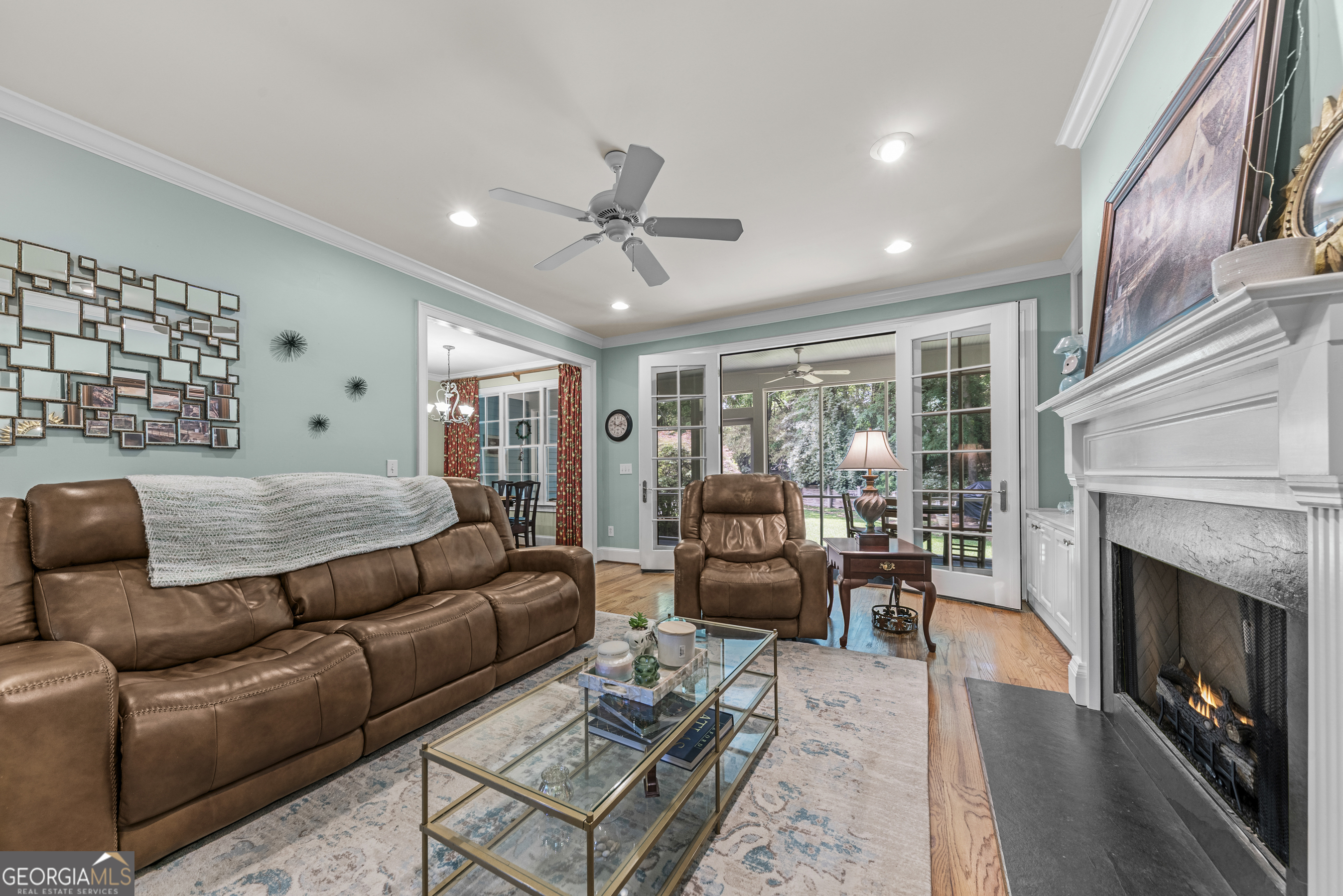524 Hillside Road Madison, GA 30650 - Photo 13 of 54 a living room with furniture ceiling fan and a fireplace