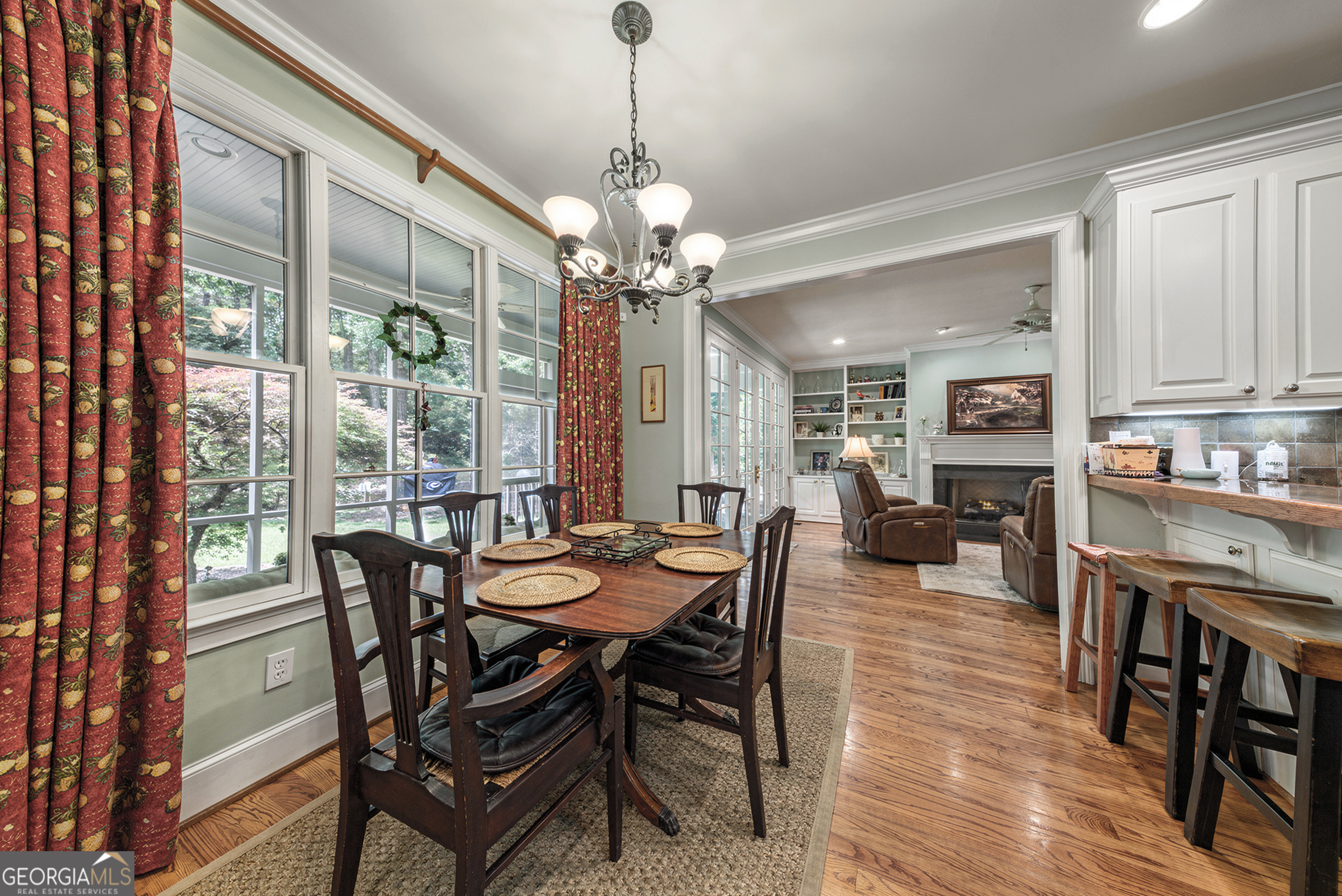 524 Hillside Road Madison, GA 30650 - Photo 19 of 54 a view of a dining room with furniture window and wooden floor
