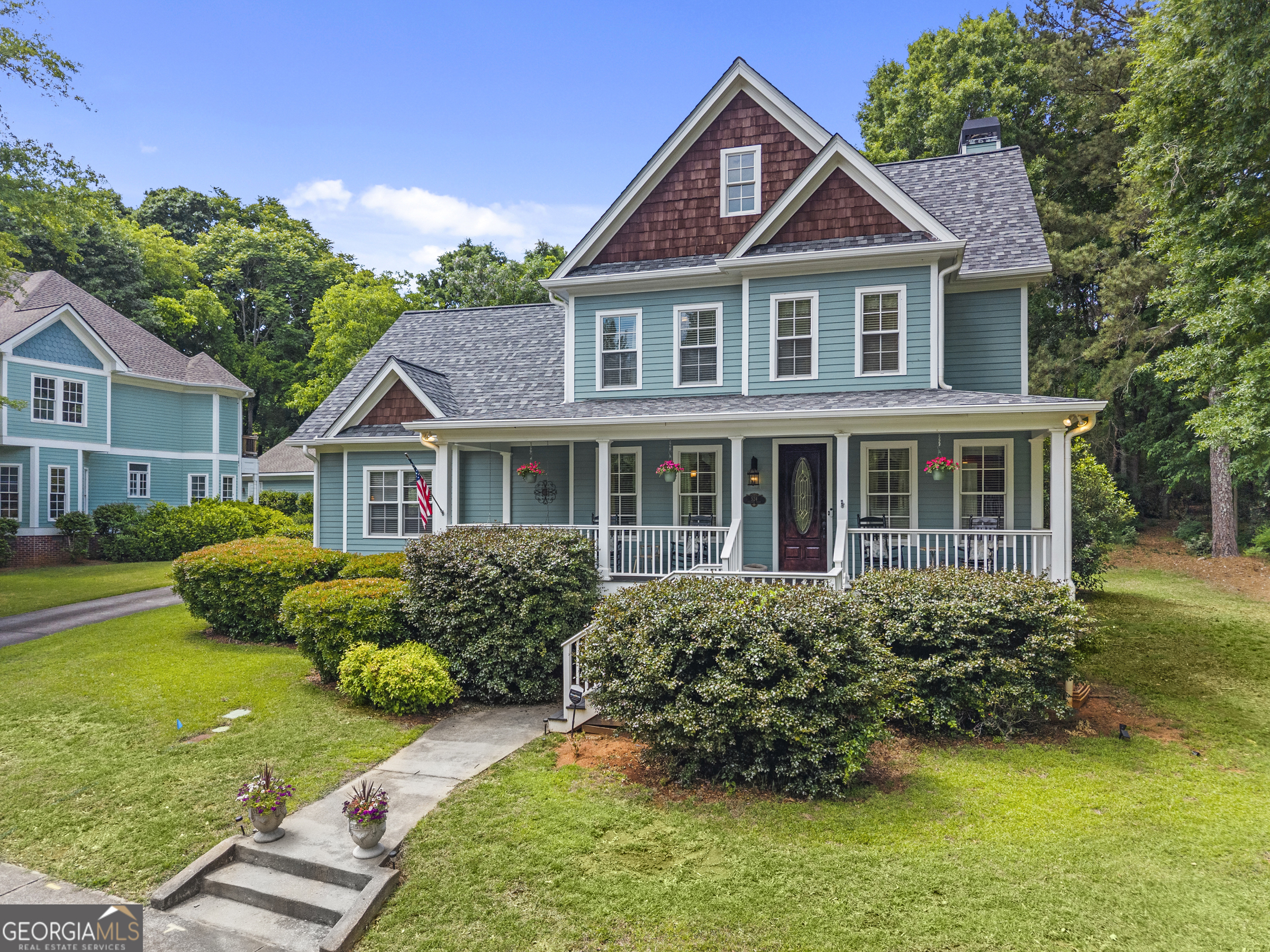 524 Hillside Road Madison, GA 30650 - Photo 2 of 54 a front view of a house with a garden