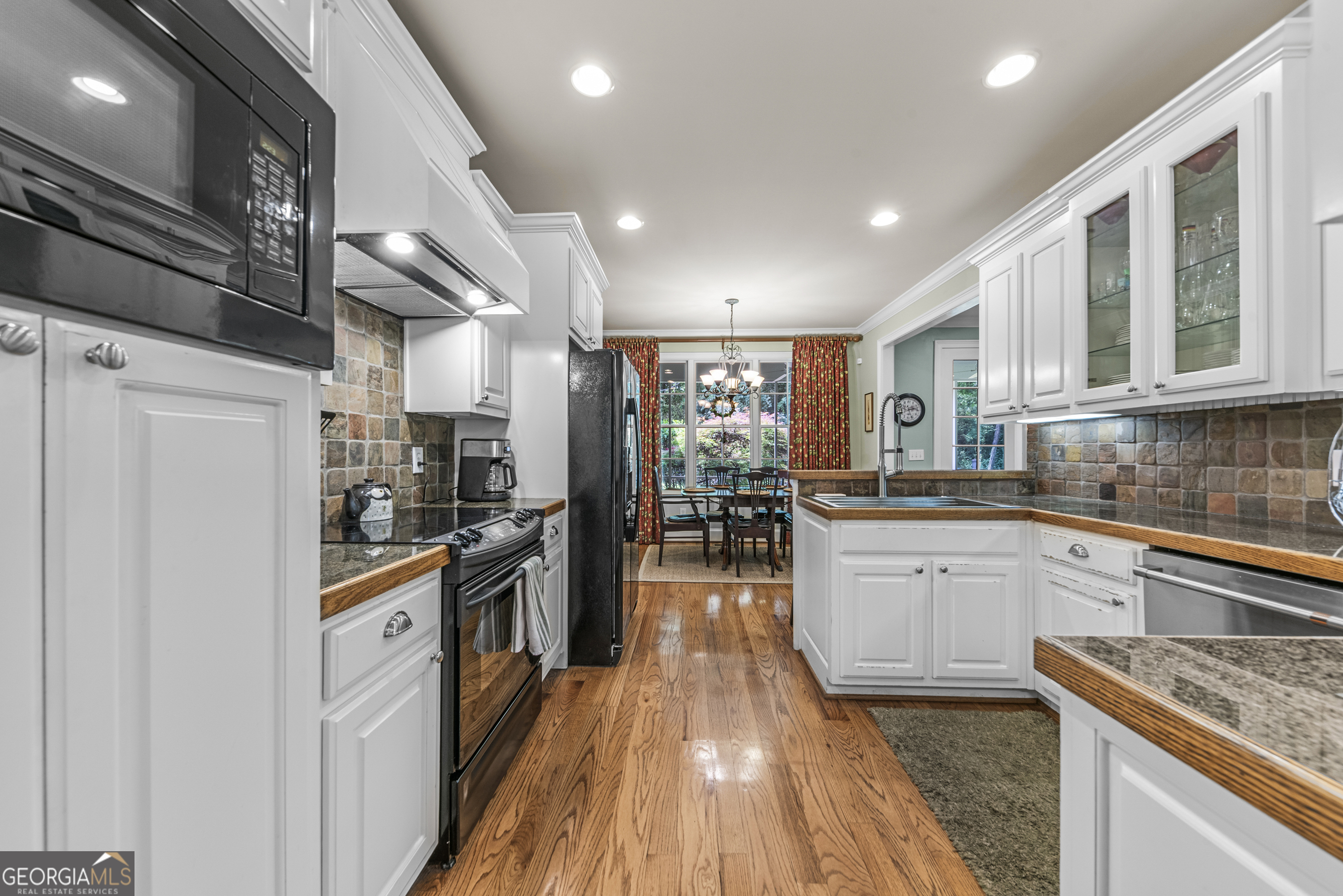 524 Hillside Road Madison, GA 30650 - Photo 21 of 54 a kitchen with stainless steel appliances granite countertop lots of counter top space and cabinets