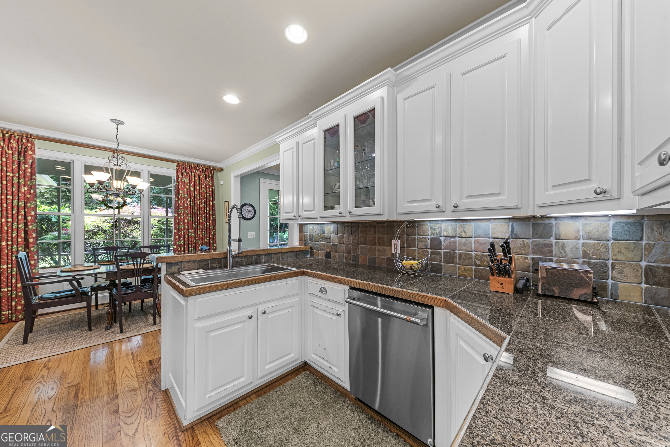 524 Hillside Road Madison, GA 30650 - Photo 22 of 54 a kitchen with a sink stove and cabinets