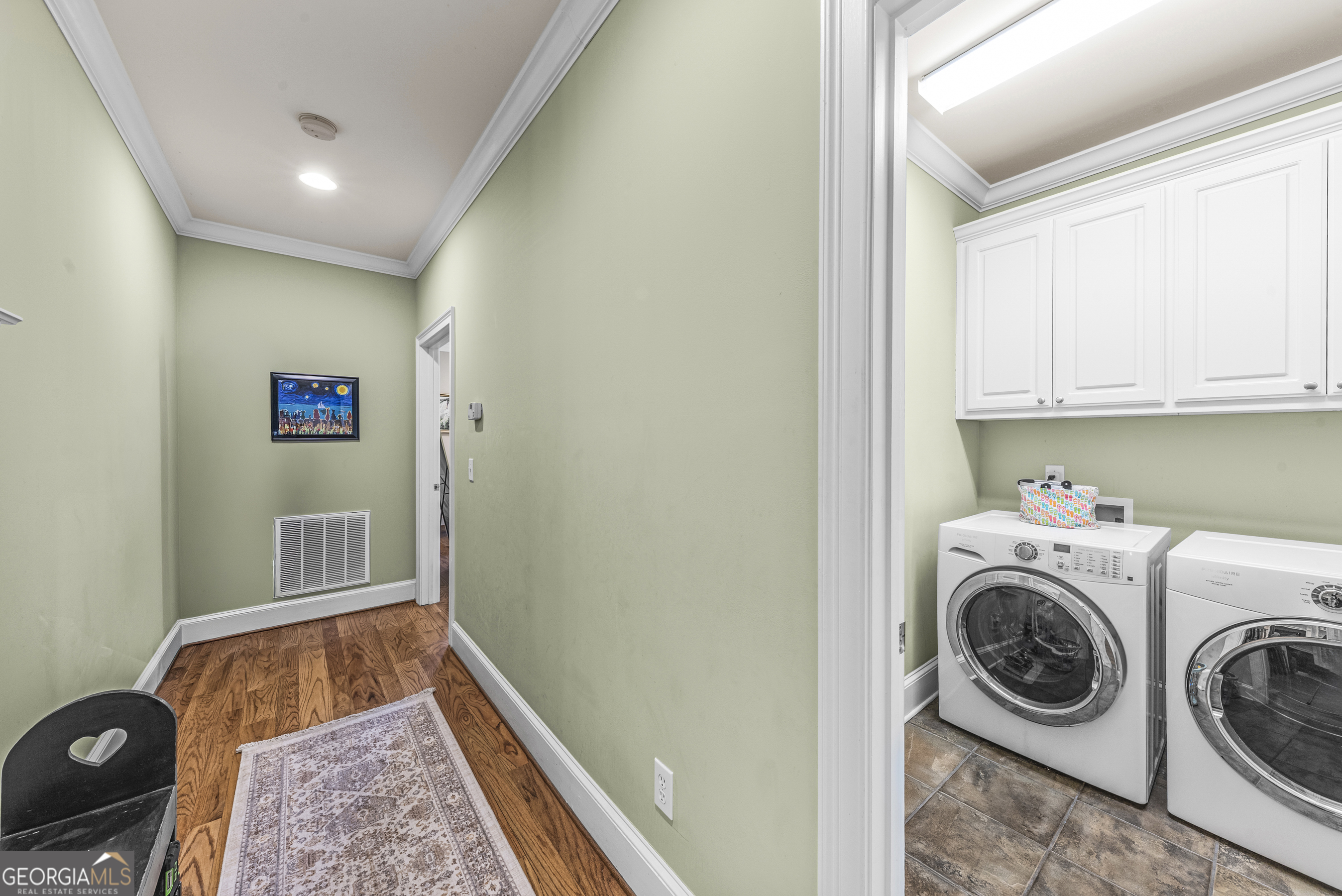 524 Hillside Road Madison, GA 30650 - Photo 24 of 54 a view of storage and utility room with washer and dryer