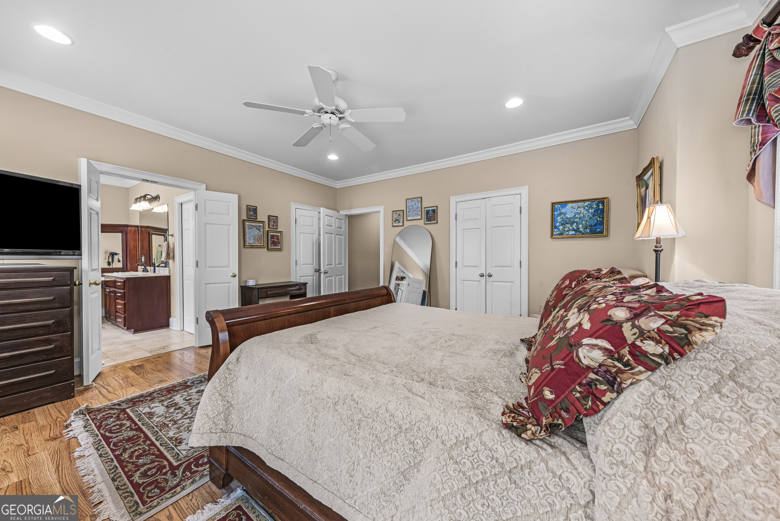 524 Hillside Road Madison, GA 30650 - Photo 27 of 54 a bedroom with a bed and a flat screen tv