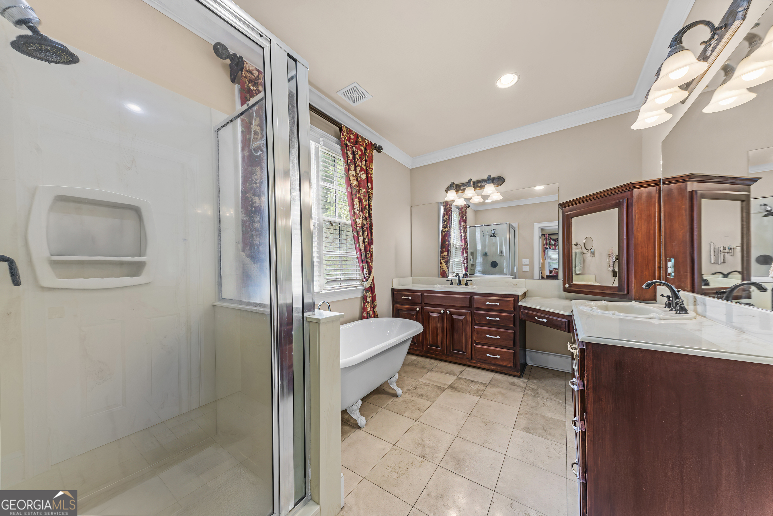 524 Hillside Road Madison, GA 30650 - Photo 28 of 54 a bathroom with a granite countertop sink mirror and bathtub
