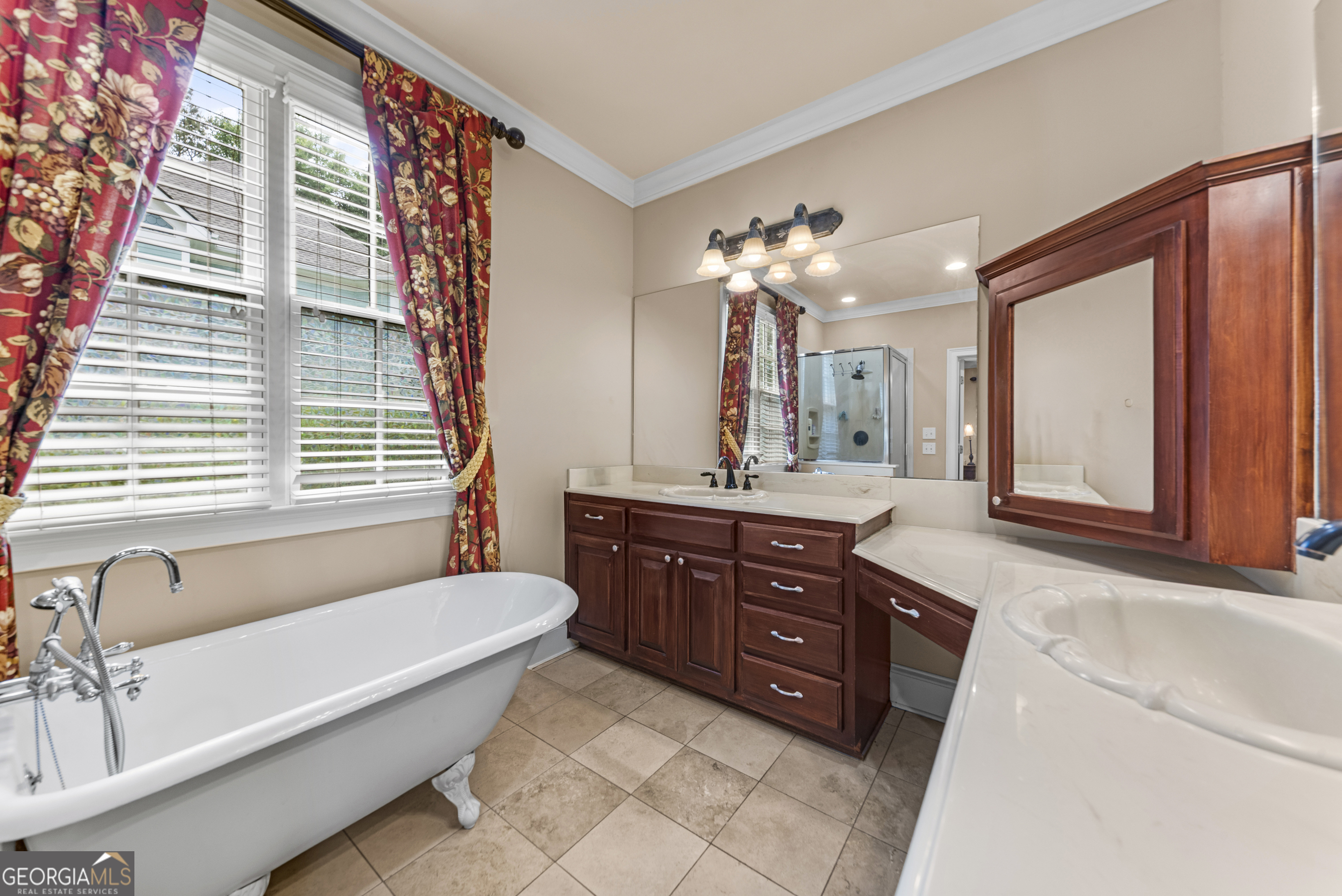 524 Hillside Road Madison, GA 30650 - Photo 29 of 54 a bathroom with a granite countertop sink and a large mirror
