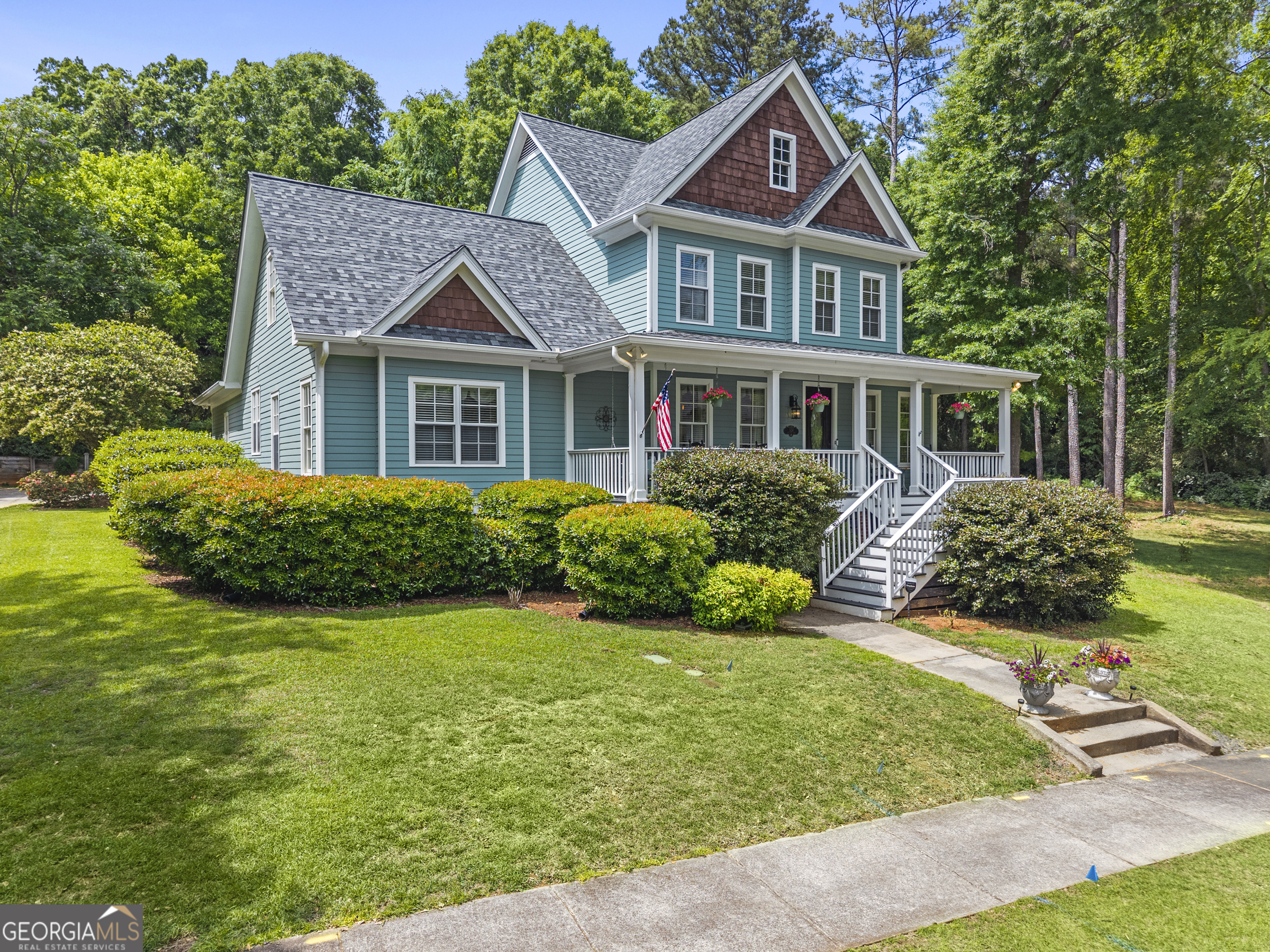 524 Hillside Road Madison, GA 30650 - Photo 3 of 54 a front view of a house with a yard