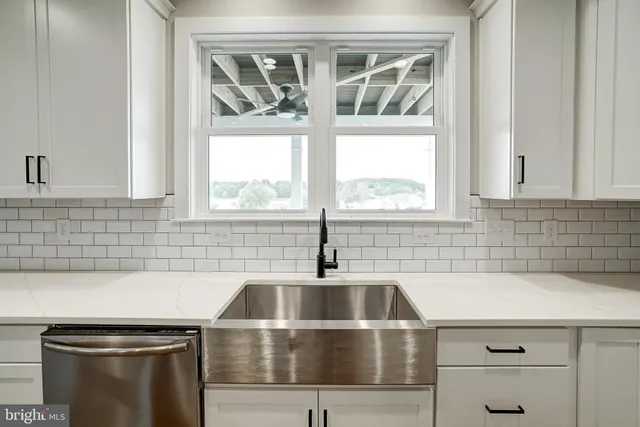 a view of an entryway with wooden floor and door