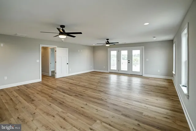 a bathroom with double sink and a mirror