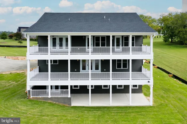 a large building with a large window and a yard