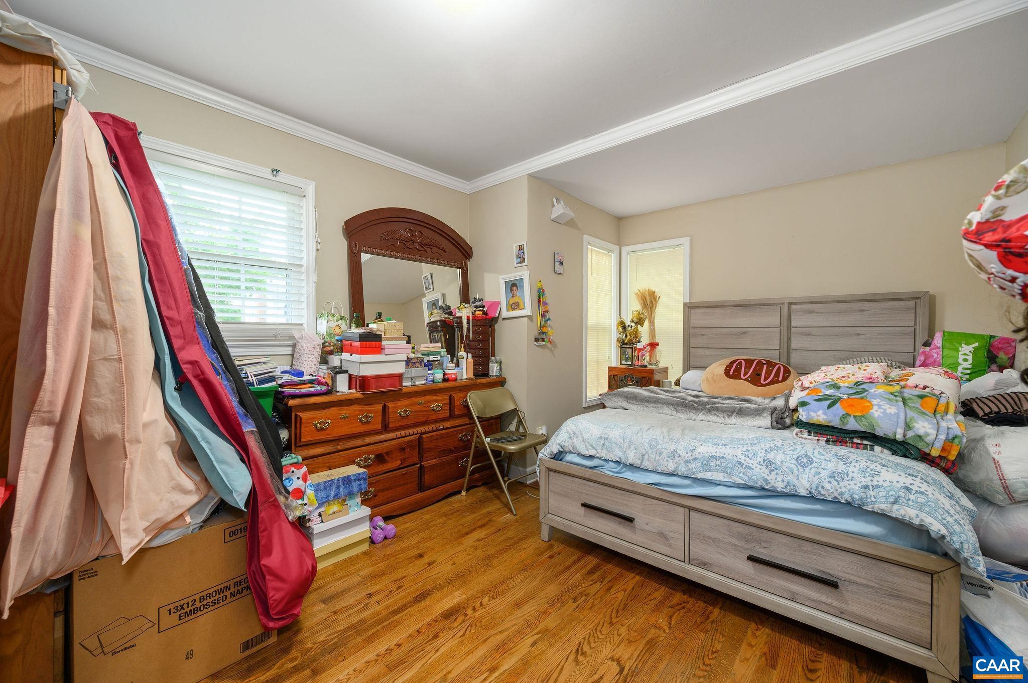 2806 Brookmere Road Charlottesville, VA 22901 - Photo 10 of 19 a bed room with a bed and a wooden floor
