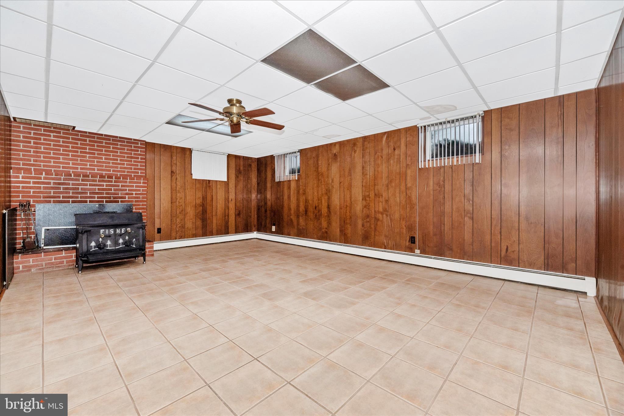 112 Dutrow Road Westminster, MD 21157 - Photo 35 of 50 Finished Lower Level with Woodstove