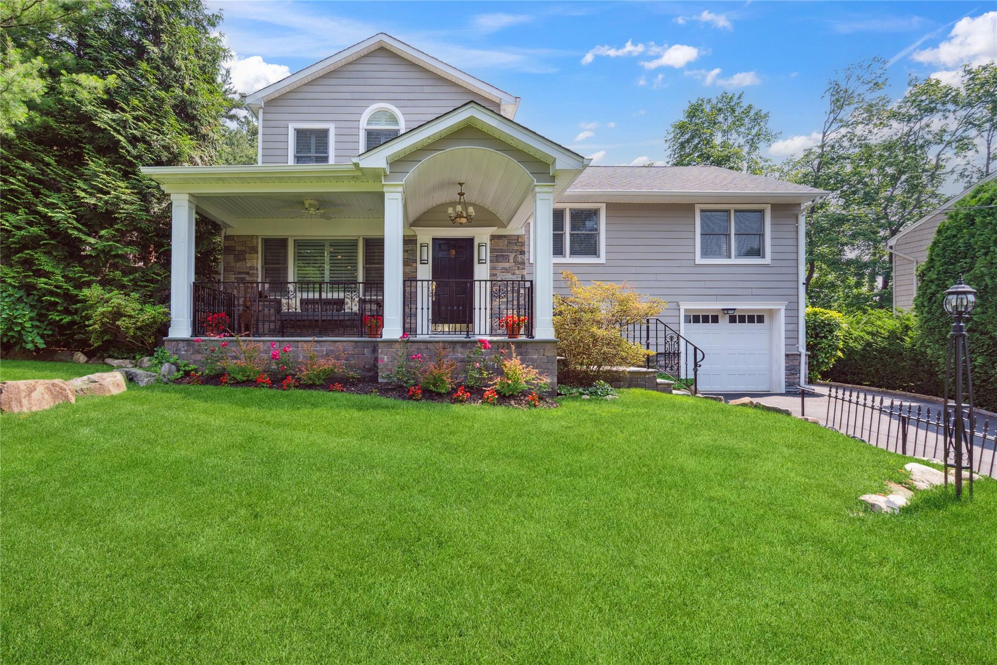 front view of a house with a yard