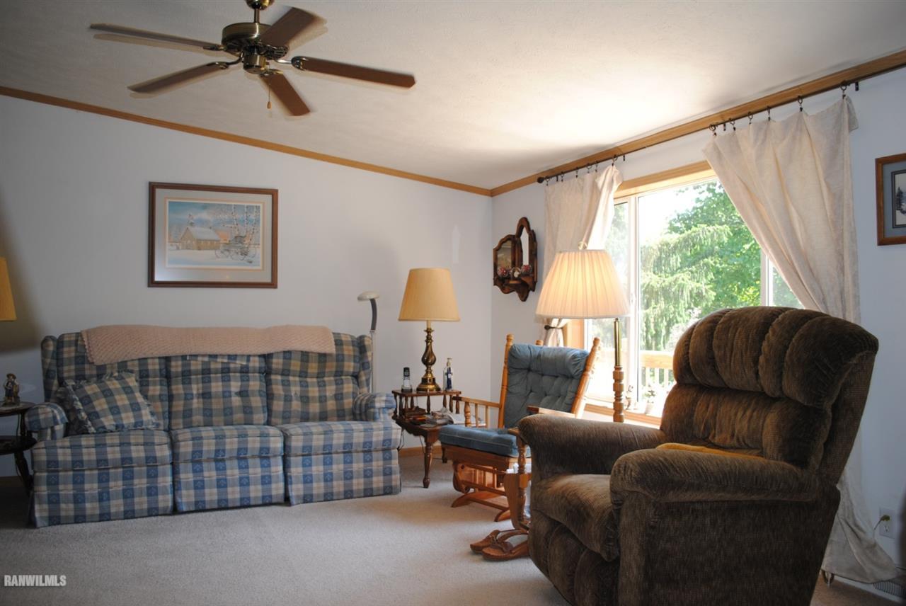 8676 West Diggin Hill Road Hanover, IL 61041 - Photo 8 of 25 a bedroom with furniture and a window
