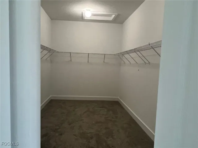 a bathroom with a granite countertop toilet