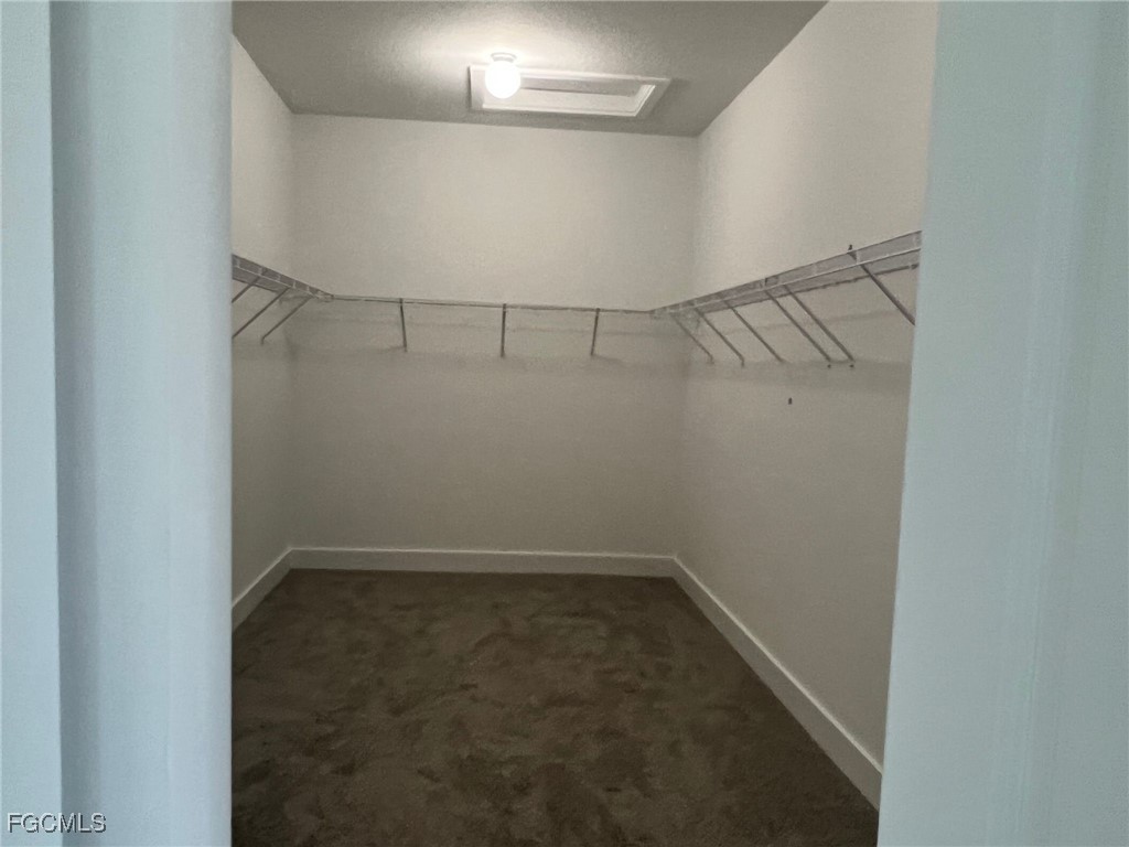 5101 Isidora Lane Ave Maria, FL 34142 - Photo 17 of 33 a view of a room with racks on the wall