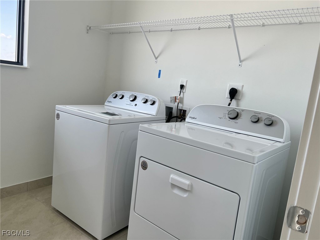 5101 Isidora Lane Ave Maria, FL 34142 - Photo 19 of 33 a utility room with dryer and washer