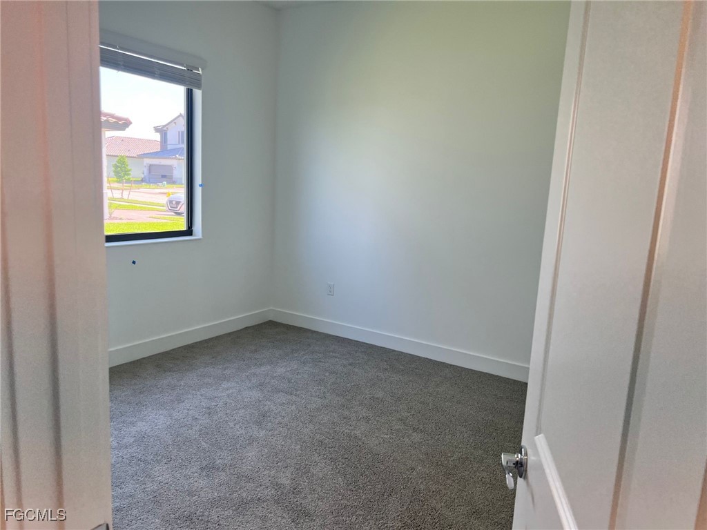 5101 Isidora Lane Ave Maria, FL 34142 - Photo 20 of 33 an empty room with windows